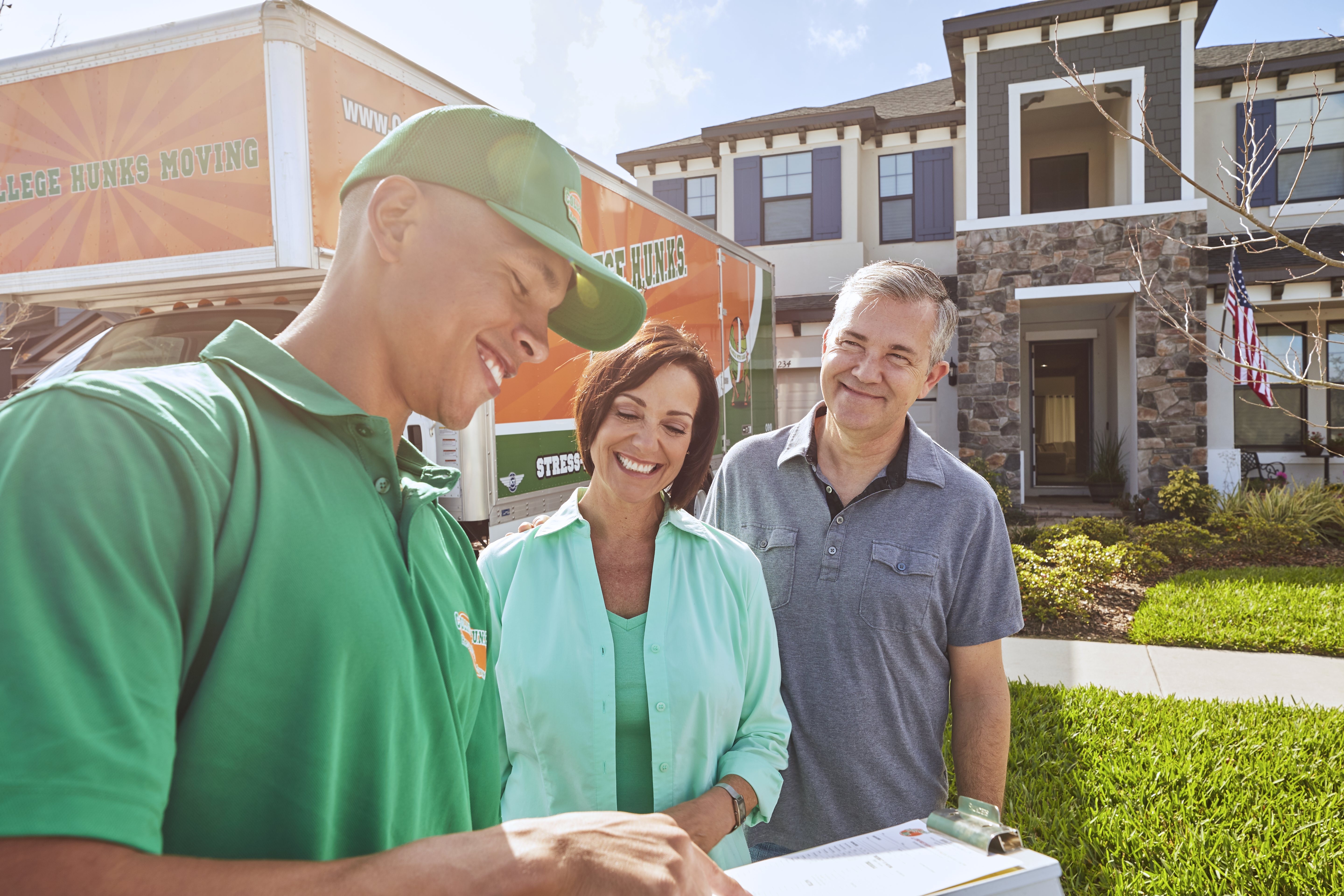 FMCSA compliant long distance movers reviewing documentation before an interstate move
