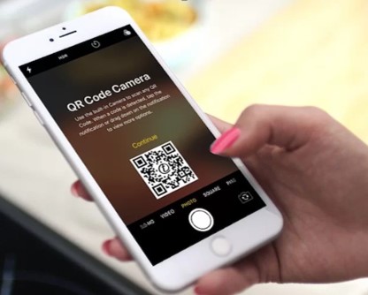 phone scanning QR Code