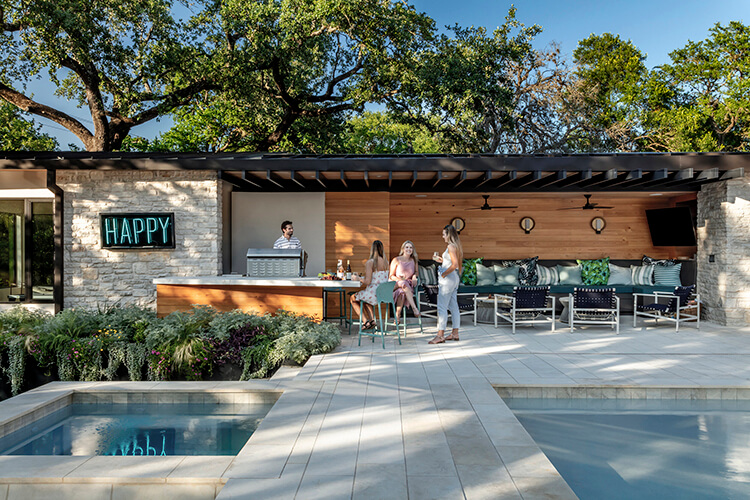 family and friends enjoying outside patio and living space