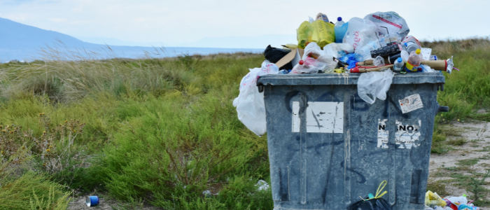 recycling bin full of plastic and paper